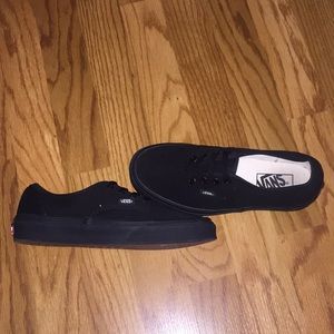 Black Vans.